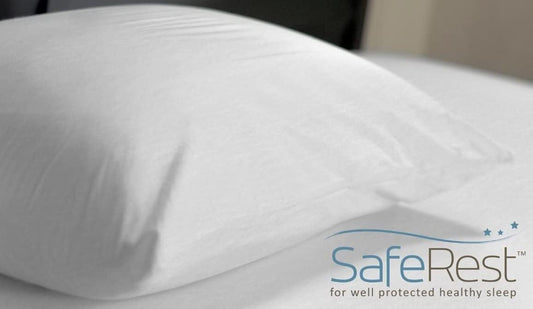 Zippered pillow protector on a made bed