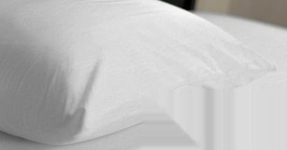 Zippered Pillow Protector on a made bed
